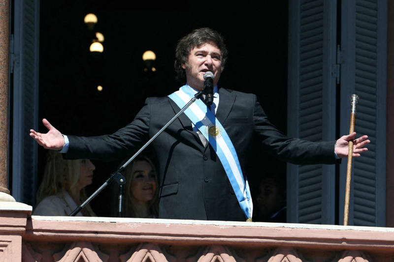 FILE PHOTO: Argentina's President Javier Milei addresses supporters from the Casa Rosada balcony, as his sister Karina Milei and his partner Fatima Florez look on, after his swearing-in ceremony, in Buenos Aires, Argentina, on 10th December, 2023