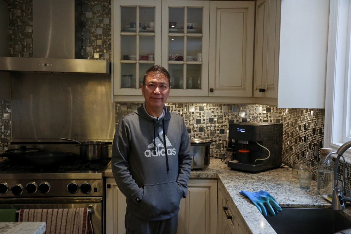 Myo Maung, 55, who immigrated from Myanmar to Canada over three decades ago, poses for photos at his home in Toronto, Ontario, Canada, on 6th December, 2023