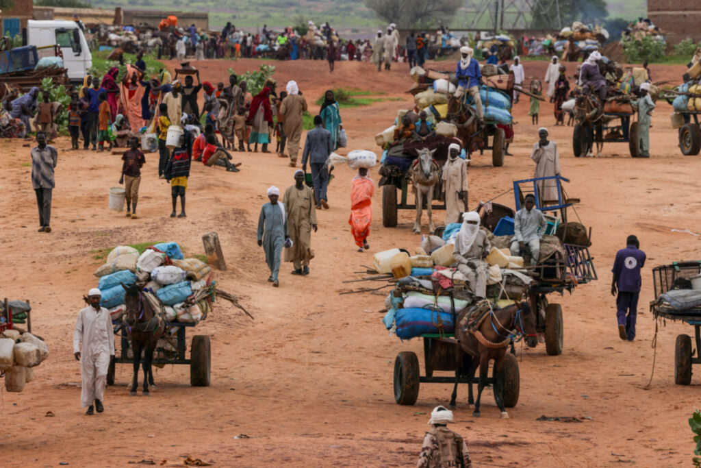 People fleeing the violence in West Darfur, cross the border into Adre, Chad, on 4th August, 2023
