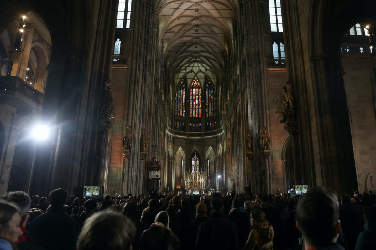 People attend a mass commemorating the victims of a shooting at one of Charles University's buildings, as people observe a national mourning day, at St Vitus Cathedral in Prague, Czech Republic, on 23rd December, 2023