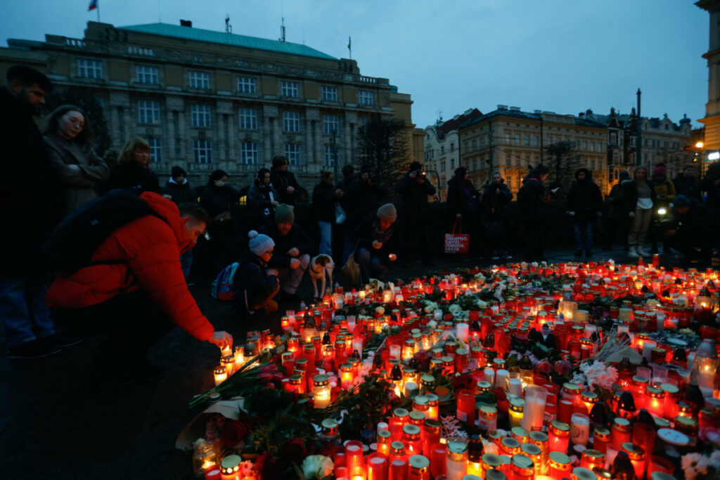 People gather at a memorial during a vigil following a shooting at one of Charles University's buildings in Prague, Czech Republic, on 22nd December, 2023