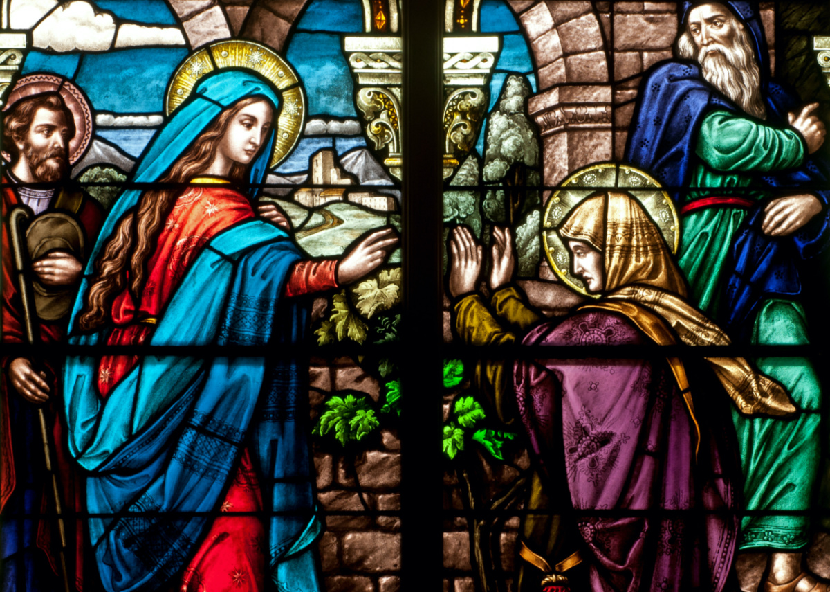 Stained glass window of bible story of the Feast of the Visitation, with the Blessed Virgin Mary visiting Elizabeth