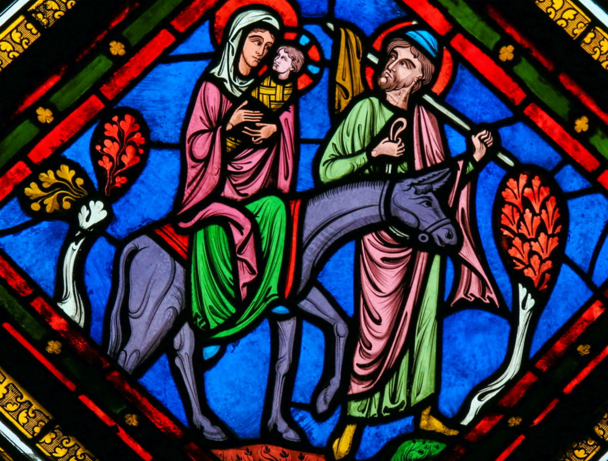 Stained Glass window in the Cathedral of Caen, Normandy, France, depicting the Flight to Egypt