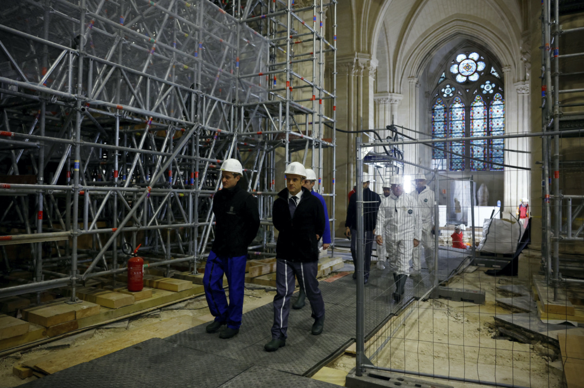 French President Emmanuel Macron,center, visits Notre Dame de Paris cathedral, on Friday, 8th December, 2023 in Paris.