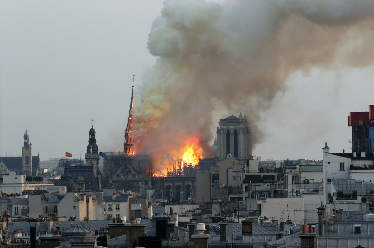 Flames rise from Notre Dame cathedral as it burns in Paris, on Monday, 15th April, 2019. 
