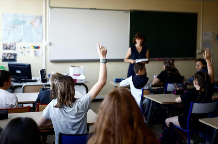 Schoolchildren work in a classroom on the first day of the new school year after summer break in Savenay, France, on 4th September, 2023