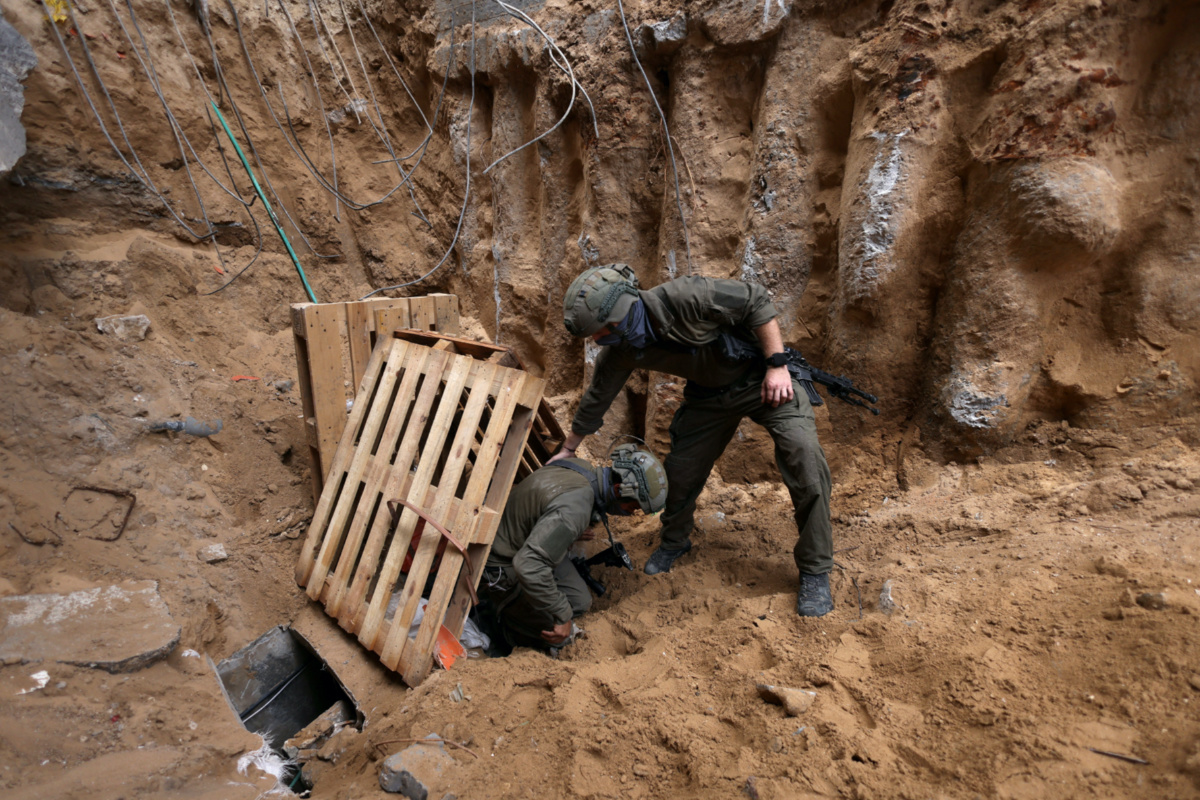 Israeli soldiers operate at the opening to a tunnel at Al Shifa Hospital compound in Gaza City, amid the ongoing ground operation of the Israeli army against Palestinian Islamist group Hamas, in the Gaza Strip, on 22nd November, 2023