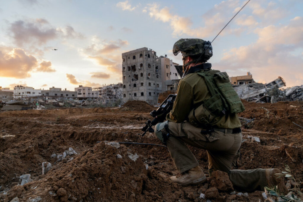 Israeli soldier takes position in the Gaza Strip, amid the ongoing conflict between Israel and the Palestinian Islamist group Hamas, in this handout picture released on 27th December, 2023.