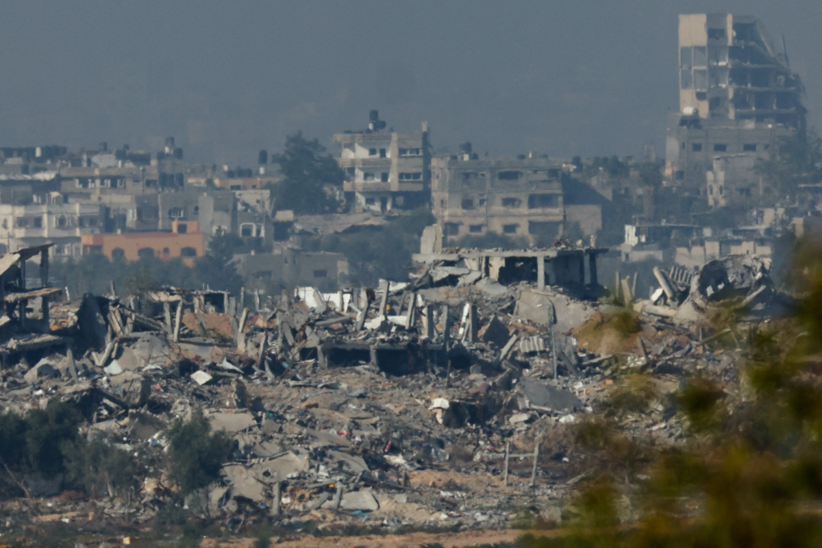 Buildings lie in ruin in Gaza, amid the ongoing conflict between Israel and the Palestinian Islamist group Hamas, as seen from southern Israel, on 4th December, 2023.