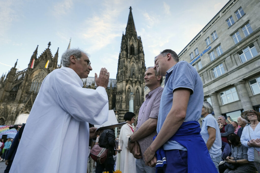 Same-sex couples take part in a public blessing ceremony in front of the Cologne Cathedral in Cologne, Germany, on 20th September, 2023