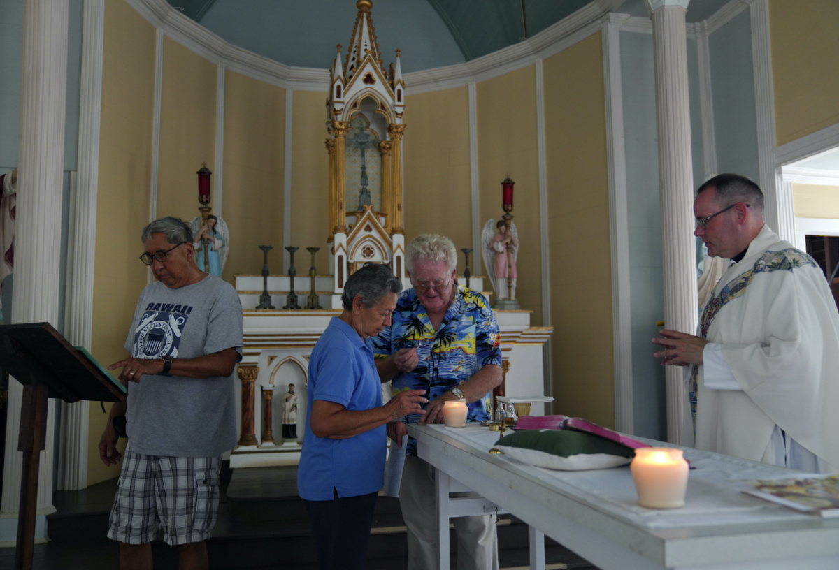 From left, Lance Toyofuku, Sister Alicia Damien Lau, Rev Patrick Killilea, and Rev Stephen Cotter, prepare for an impromptu Mass held at St Philomena Church on Kalaupapa, Hawaii, on Tuesday, 18th July, 2023