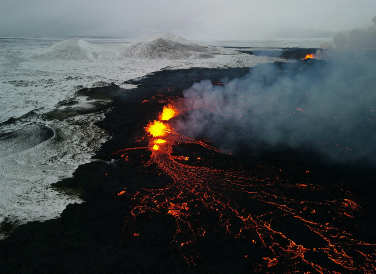A drone picture shows lava spewing from the site of the volcanic eruption north of Grindavik, photographed from Sylingarfell, Iceland, on 19th December, 2023.