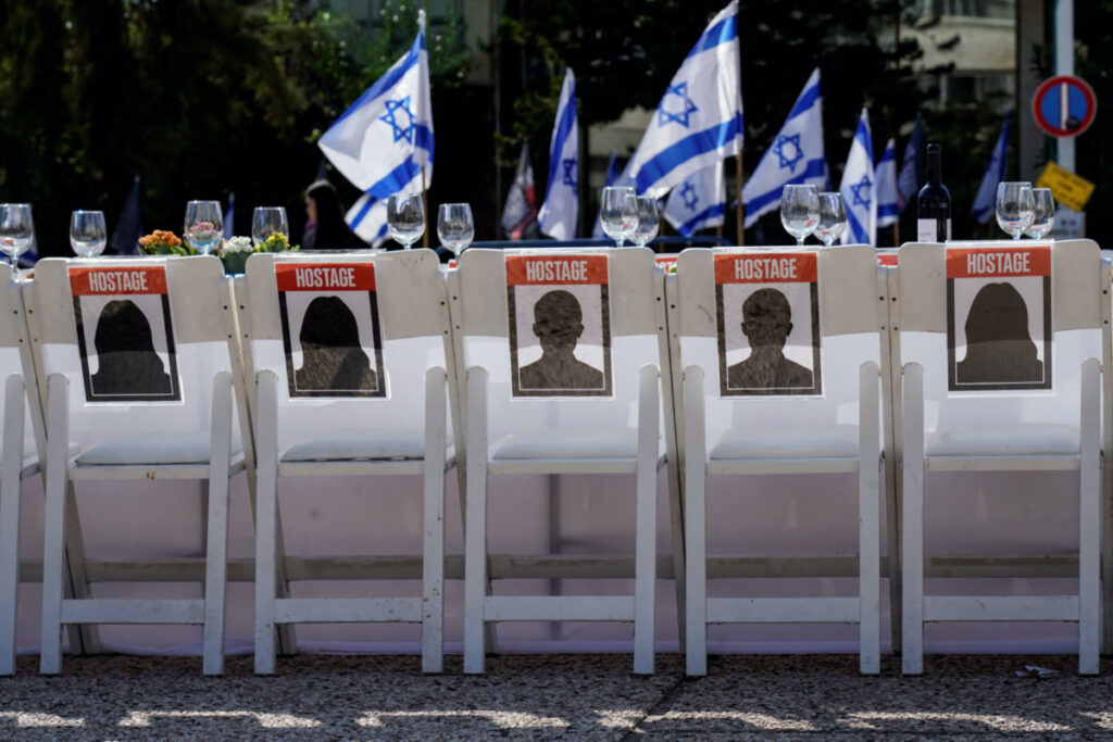 A dinner table is set with empty chairs that symbolically represent hostages and missing people with families that are waiting for them to come home, following a deadly infiltration by Hamas gunmen from the Gaza Strip, in Tel Aviv, Israel, on 20th October, 2023