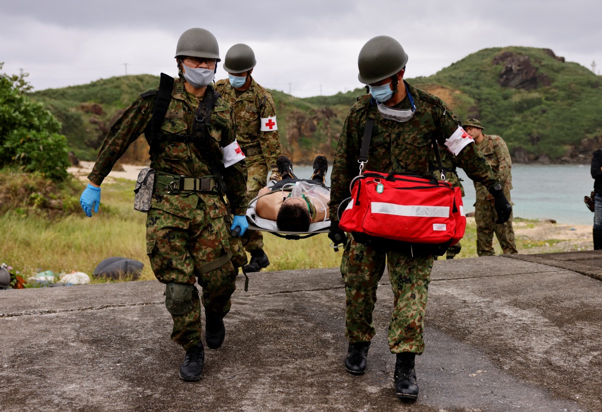 Japan Self-Defense Forces soldiers take part in an evacuation drill on Yonaguni island, Japan's westernmost inhabited island in Okinawa prefecture, Japan, on 12th November, 2023