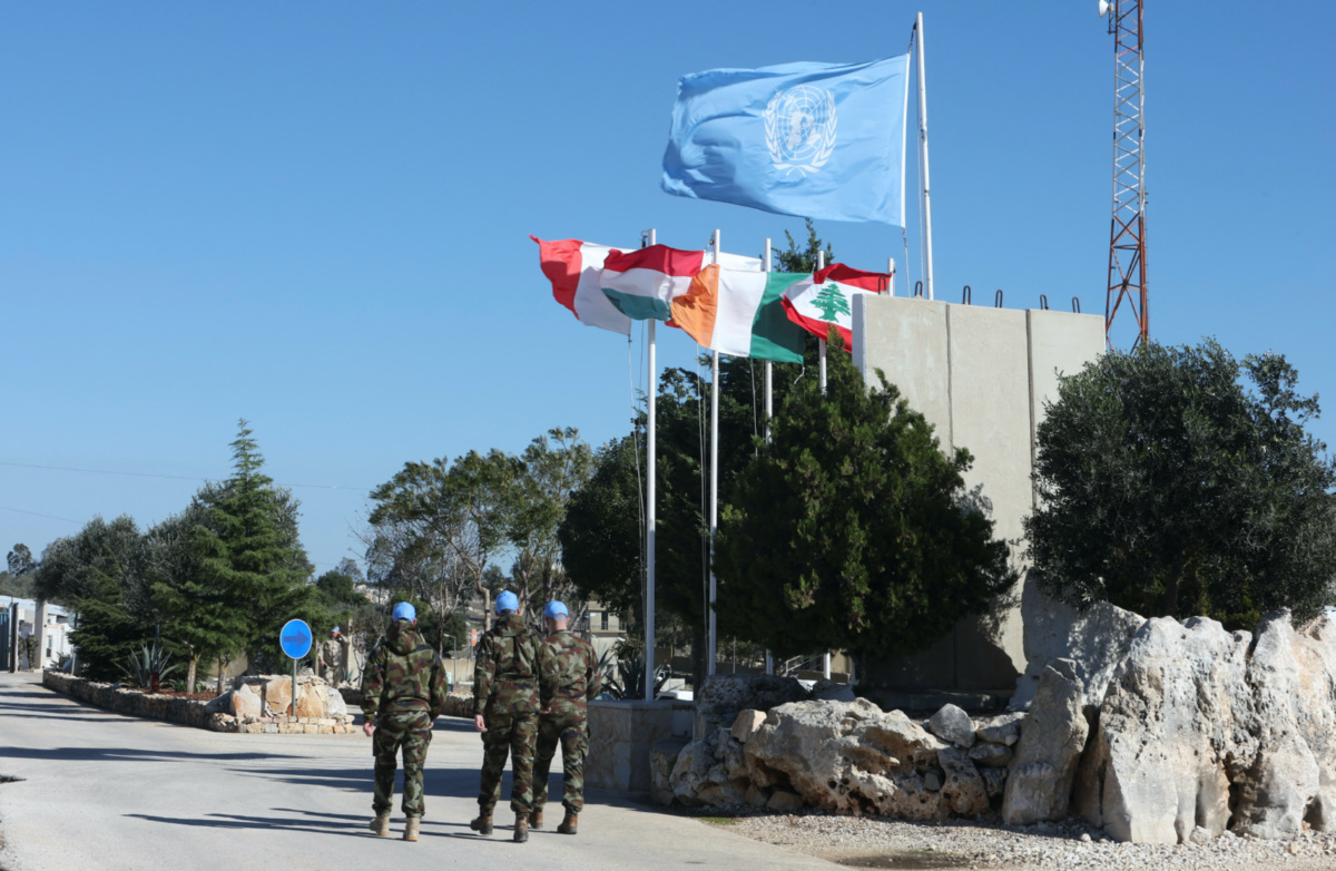 UN peacekeepers walk past flags during a Reuters visit to Camp Shamrock where Irish and Polish peacekeepers of the United Nations Interim Force in Lebanon are stationed, near Maroun al-Ras village close to the Lebanese-Israeli border, in southern Lebanon on 29th November, 2023