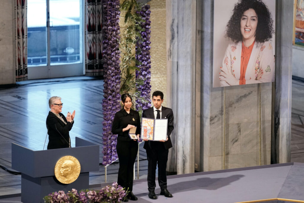Ali and Kiana Rahmani, children of Narges Mohammadi, an imprisoned Iranian human rights activist, hold the Nobel Peace Prize 2023 award, accepting it on behalf of their mother at Oslo City Hall, Norway, on 10th December, 2023.