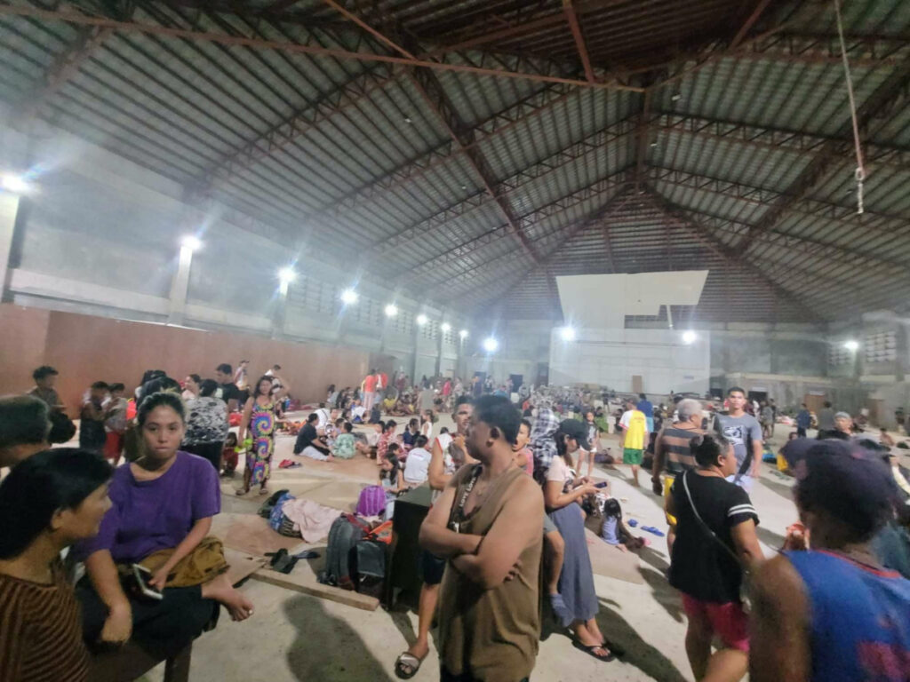 People gather at an evacuation center, in the aftermath of an earthquake, in Hinatuan, Surigao del Sur, Philippines on 2nd December, 2023