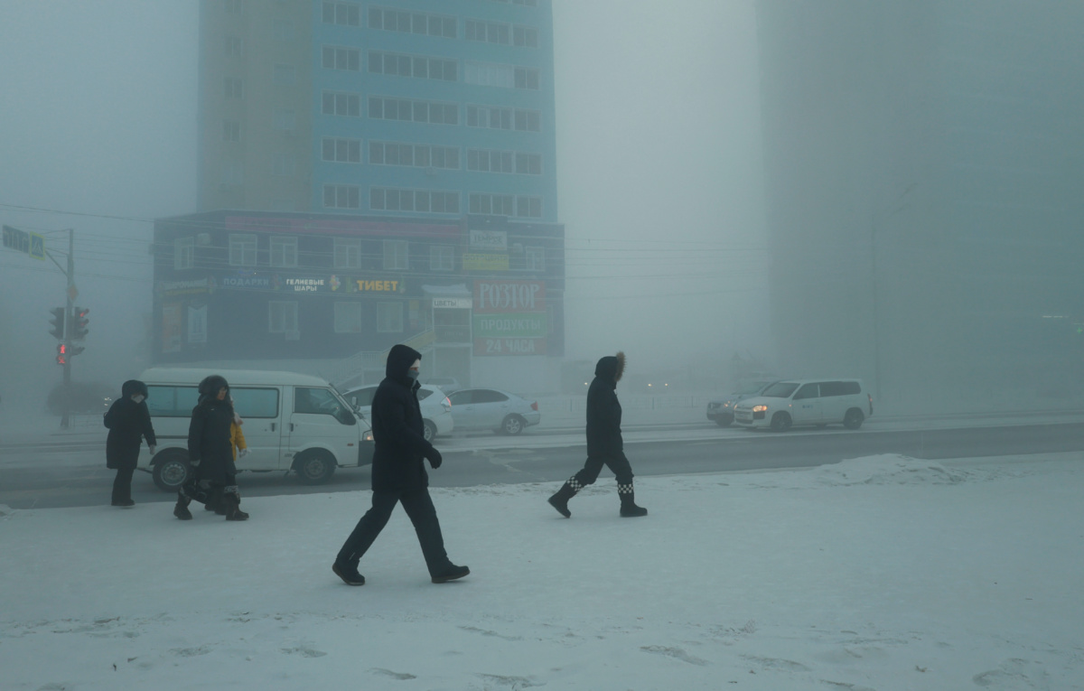 Pedestrians walk along a street on a frosty day in Yakutsk, Russia, on 5th December, 2023.