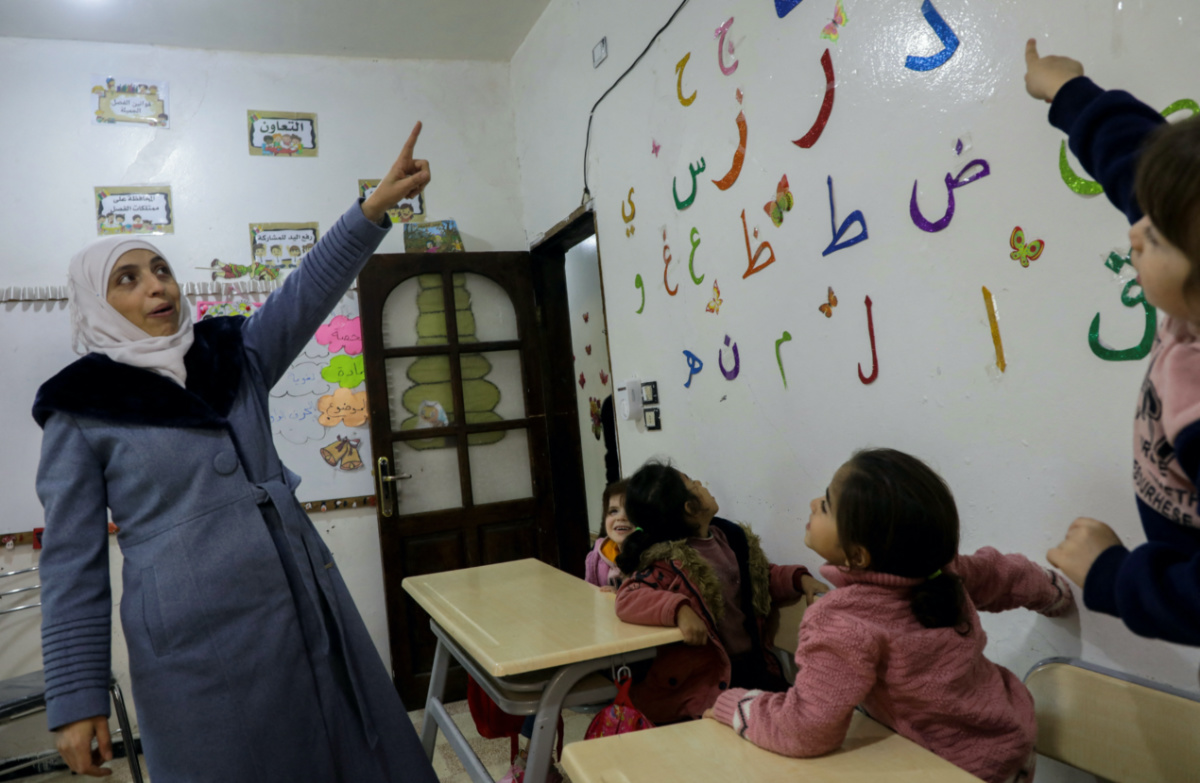 Safaa Kamel, 35, a teacher who says she suffered health effects following a gas attack on her home region of Eastern Ghouta in Syria in 2013 and, now displaced to the north-western Syrian region of Afrin, takes a class at a school in the northern Syrian town of Afrin, Syria on 28th November, 2023