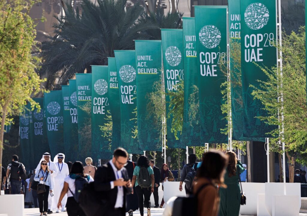 Delegates walk at the United Nations Climate Change Conference COP28 in Dubai, United Arab Emirates, on 8th December, 2023