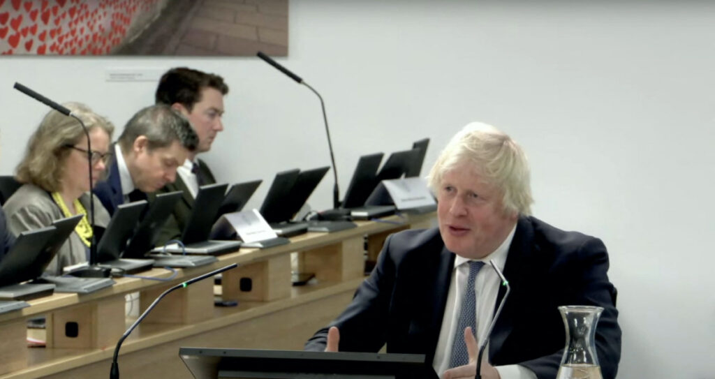 Former British Prime Minister Boris Johnson gives evidence at the COVID-19 Inquiry, in London, Britain, on 7th December, 2023 in this screen grab obtained from a handout video