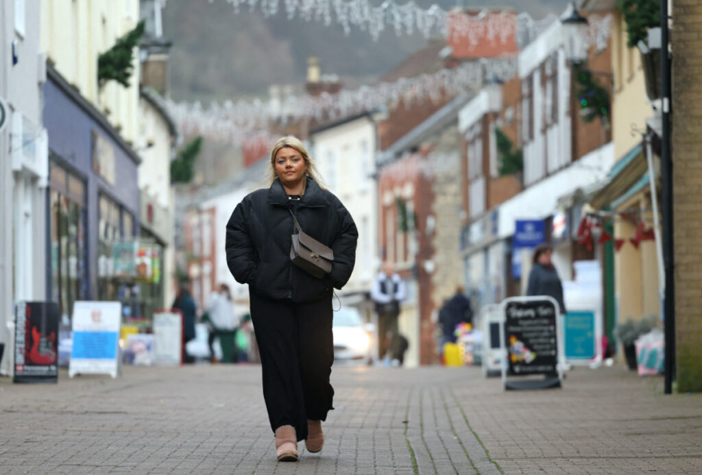 Rebecca Kaya walks through the town centre, following an interview with Reuters, in Dursley, south west Britain, on 18th December, 2023