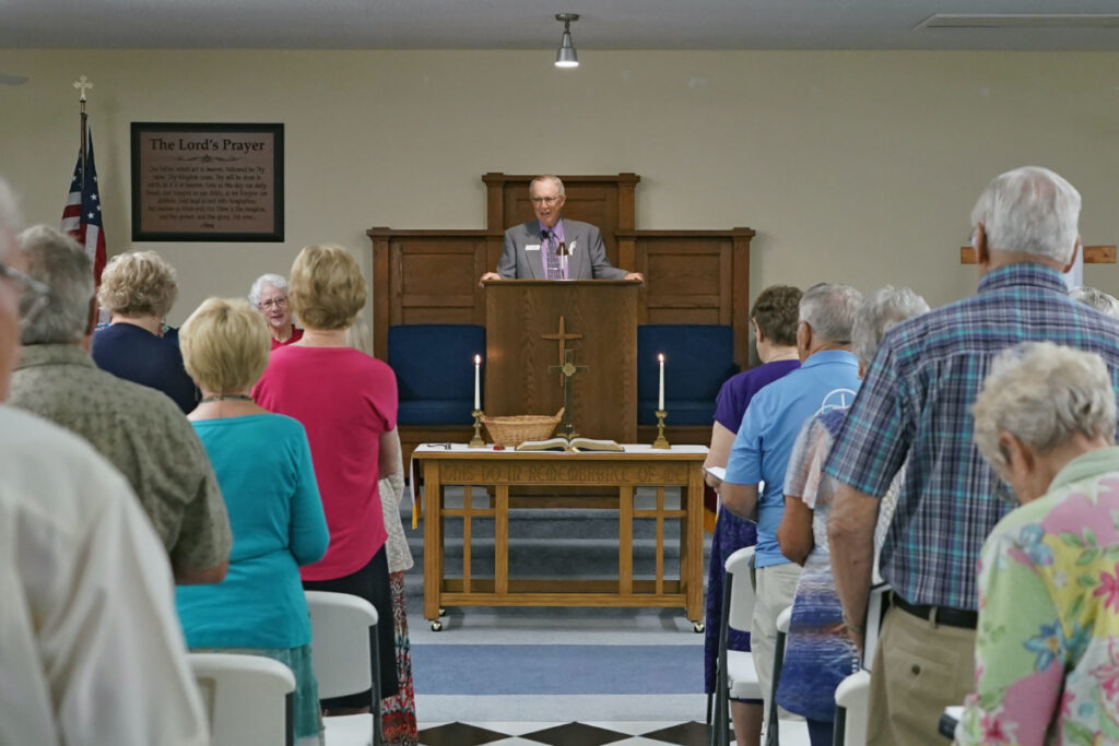 Rev Bill Farmer, center, speaks to members of the congregation during service at the Grace Methodist Church on Sunday, 14th May, 2023, in Homosassa Springs, Florida.