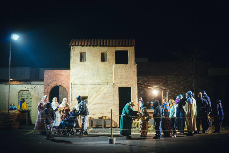 Walk-through guests interact with the cast at the Bethlehem market during the 2015 Lafayette Living Nativity, which is hosted by Faith Church of Lafayette, Indiana.