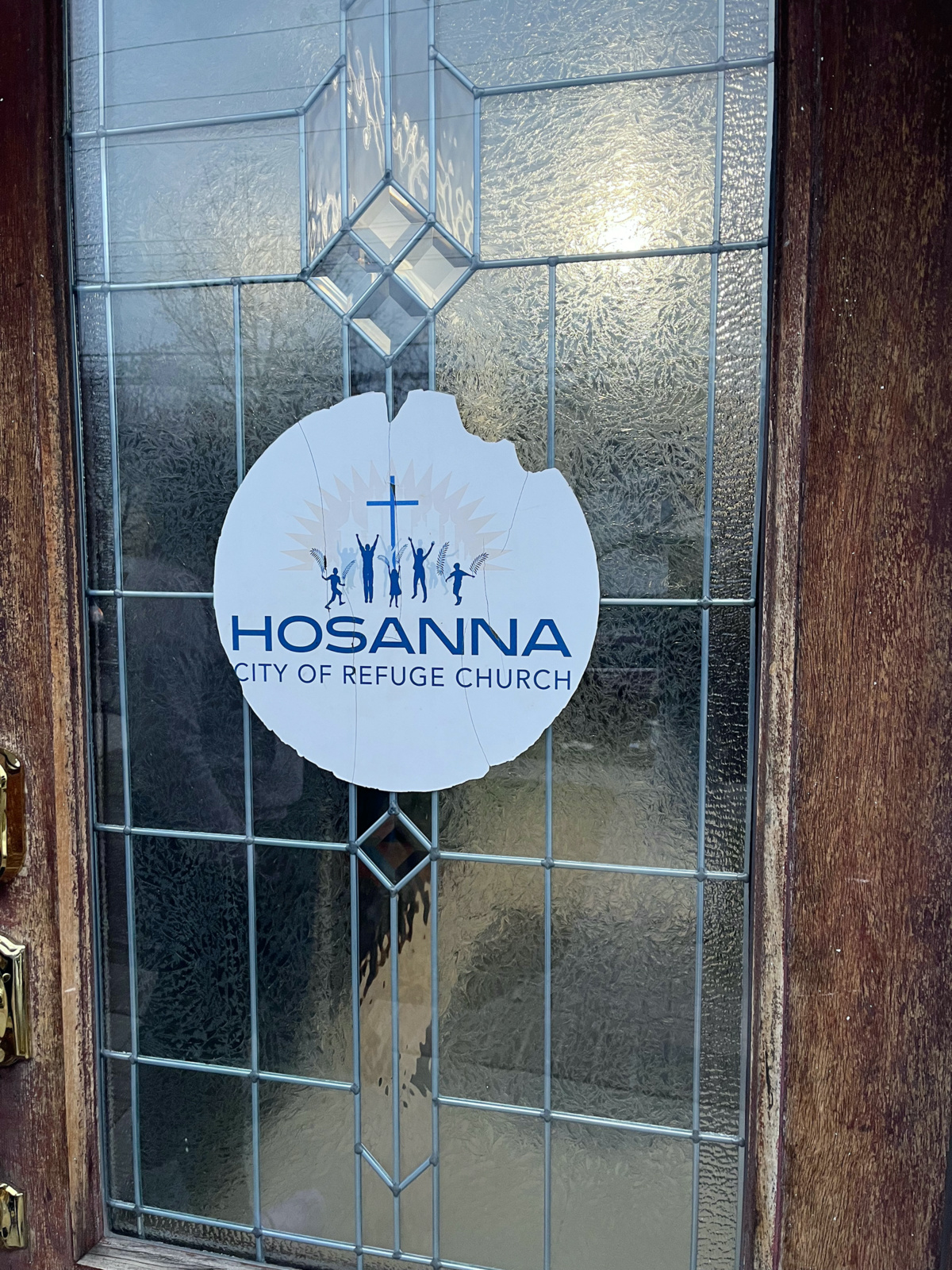 A worn sticker at Hosanna City of Refuge Church in Queens, New York.
