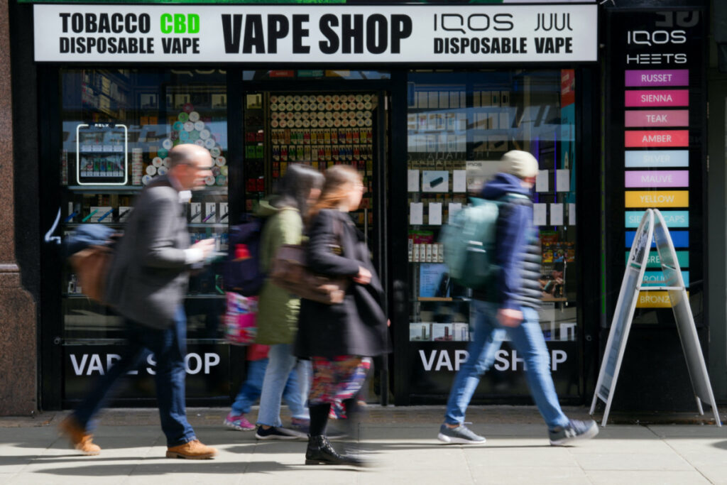 People walk past a Vape Shop in central London, Britain, on 11th April, 2023.