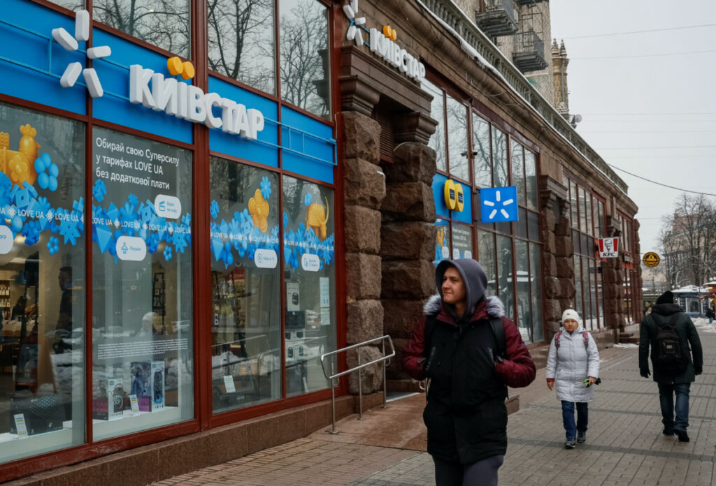 People walk past a store of Ukraine's telecommunications company Kyivstar, amid Russia's attack on Ukraine, in Kyiv, Ukraine on 12th December, 2023.