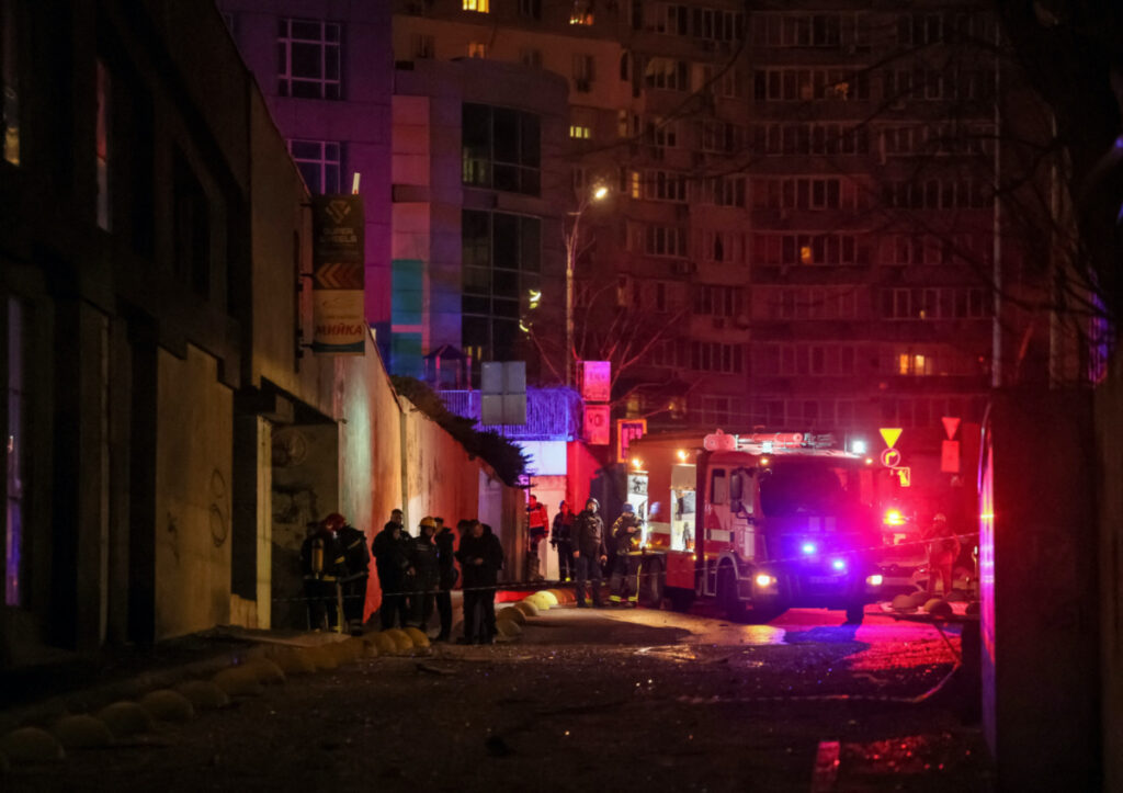 Emergency staff work at a site of an apartment building damaged during a Russian drone strike, amid Russia's attack on Ukraine, in Kyiv, Ukraine, on 22nd December, 2023.