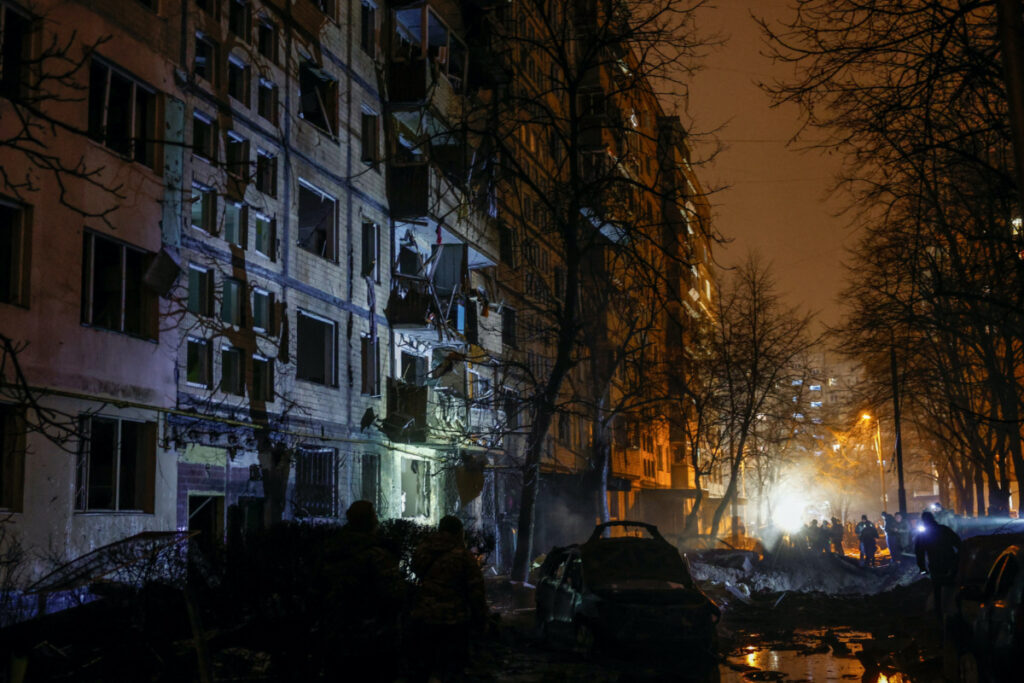 Emergency staff work at a site of an apartment building damaged during a Russian missile strike, amid Russia's attack on Ukraine, in Kyiv, Ukraine, on 13th December, 2023
