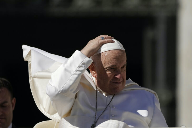 Pope Francis adjusts his skull cap at the end of his weekly general audience in St. Peter's Square at The Vatican, on Wednesday, 15th March, 2023