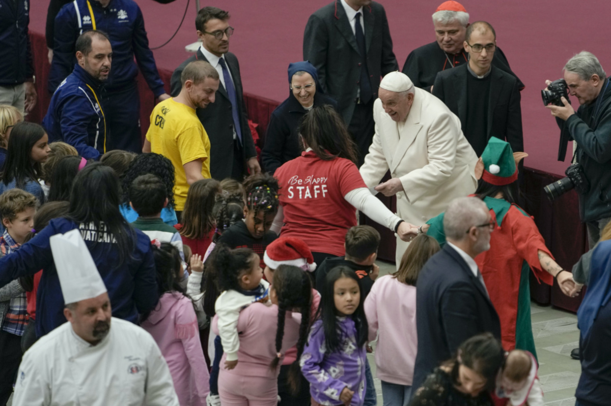 Pope Francis talks to youths as he celebrates his birthday with children assisted by the Santa Marta dispensary during an audience in the Paul VI Hall, at the Vatican, on Sunday, 17th December, 2023.