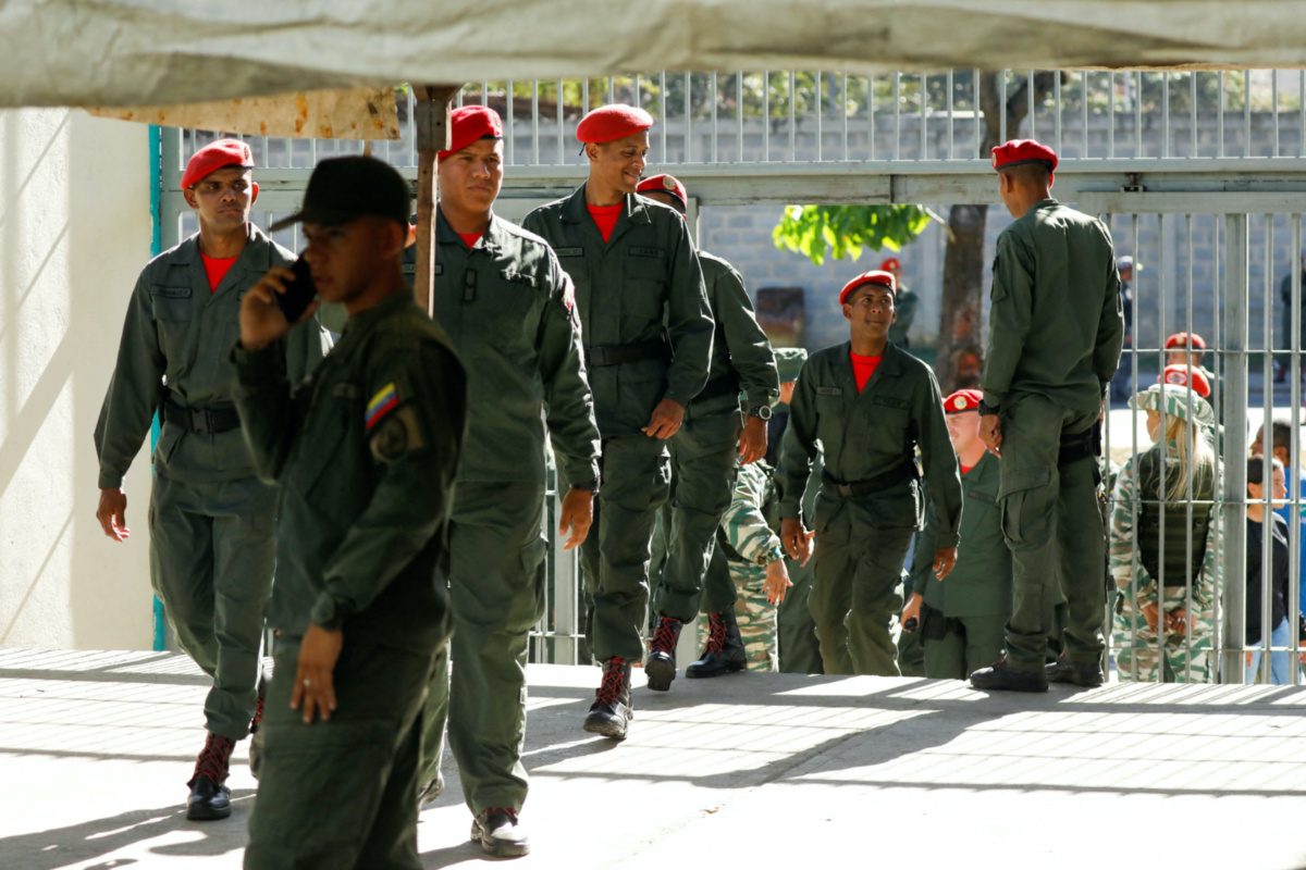 Members of the Venezuelan Armed Forces walk on the day of an electoral referendum over Venezuela's rights to the potentially oil-rich region of Esequiba, which has long been the subject of a border dispute between Venezuela and Guyana, in Caracas, Venezuela on 3rd December, 2023.