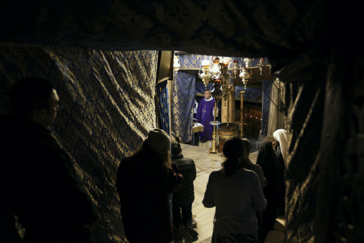 People visit the Grotto under the Church of the Nativity, traditionally believed to be the birthplace of Jesus, on Christmas Eve, in the West Bank city of Bethlehem, on Sunday, 24th December, 2023