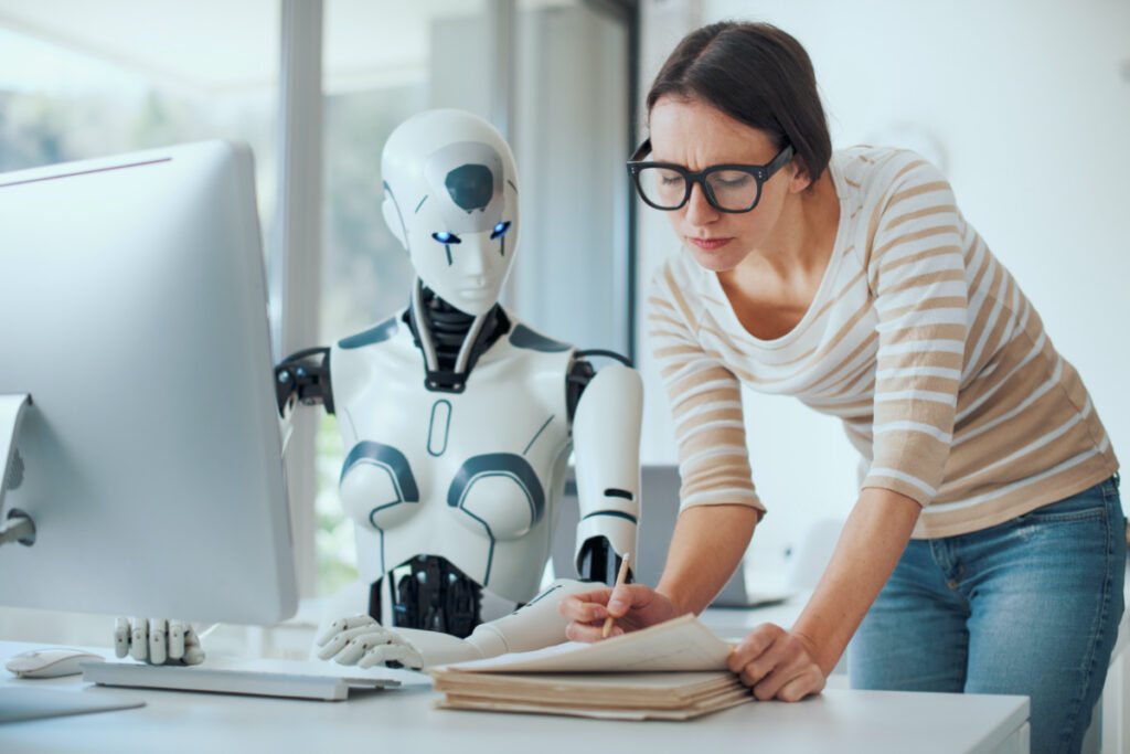 Woman and AI robot working together in the office