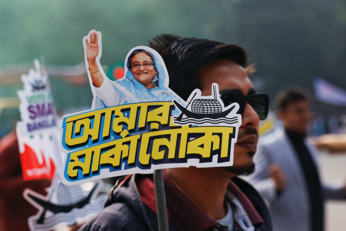 A student holds a placard of Prime Minister Sheikh Hasina as they celebrate the formation day of Bangladesh Chhatra League, the student wing of Bangladesh Awami League, at the University of Dhaka, ahead of the general election in Dhaka, Bangladesh, on 4th January, 2024. 