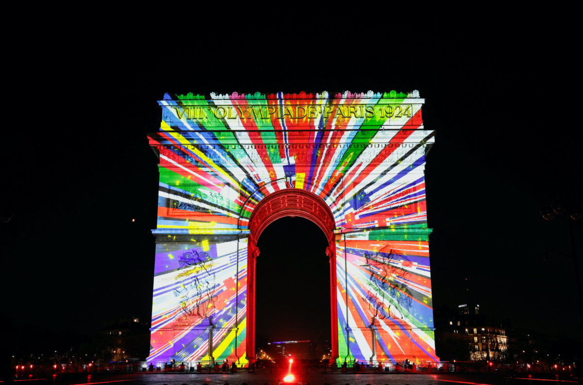 An image is projected onto the Arc de Triomphe to celebrate the entry into the Olympic year, during the New Year's celebrations on the Champs Elysees avenue in Paris, France, on 31st December, 2023