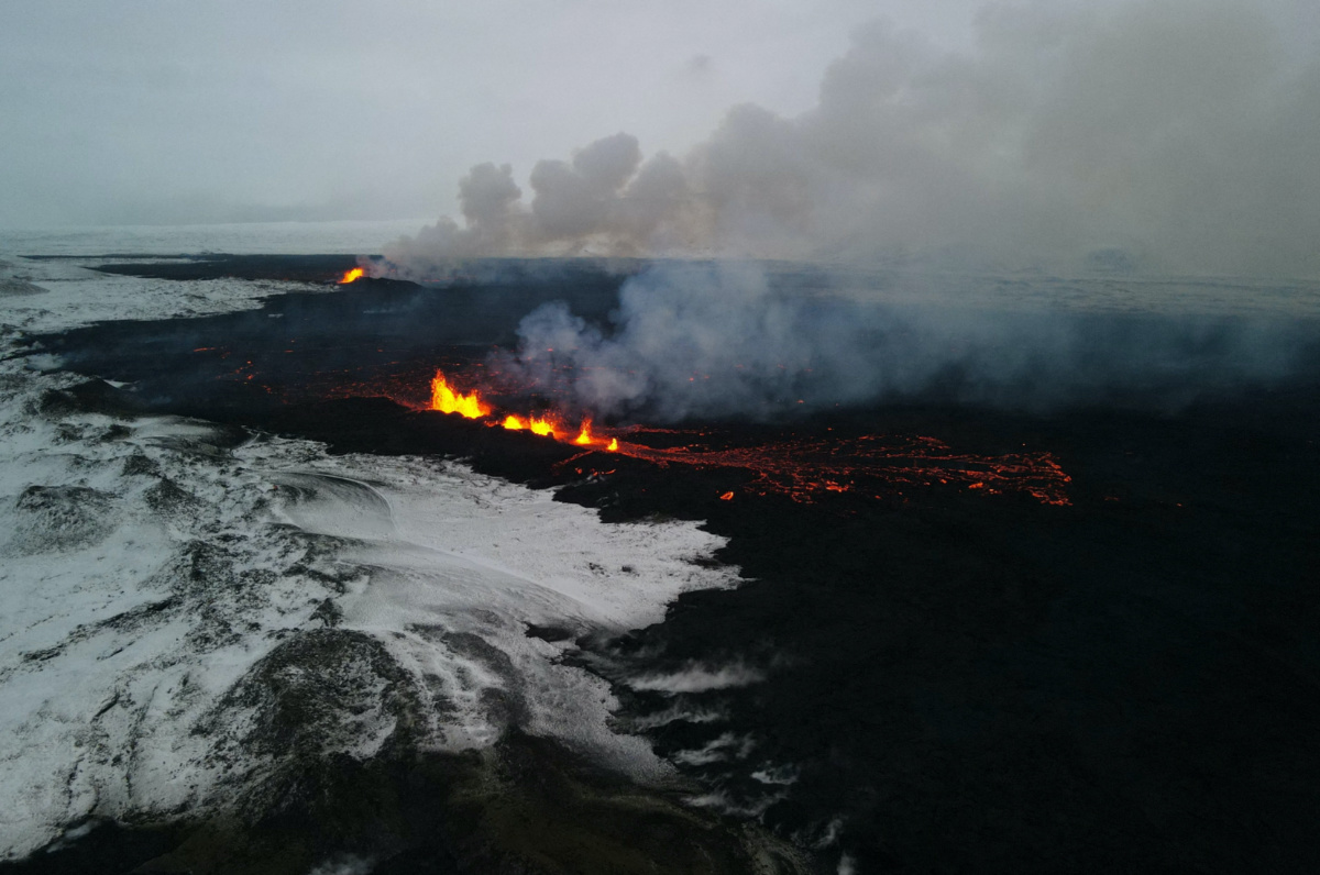 A drone picture shows lava spewing from the site of the volcanic eruption north of Grindavik, photographed from Sylingarfell, Iceland, on 19th December, 2023
