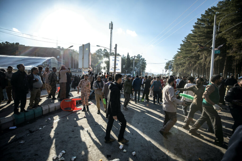 People gather at the scene of explosions during a ceremony held to mark the death of late Iranian General Qassem Soleimani, in Kerman, Iran, on 3rd January, 2024.