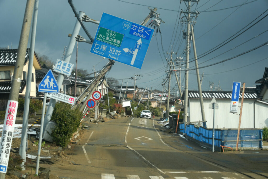 Road signs are tilted over a road damaged by the 1st January earthquake in Nishiaraya, Ishikawa Prefecture, Japan, on 8th January, 2024
