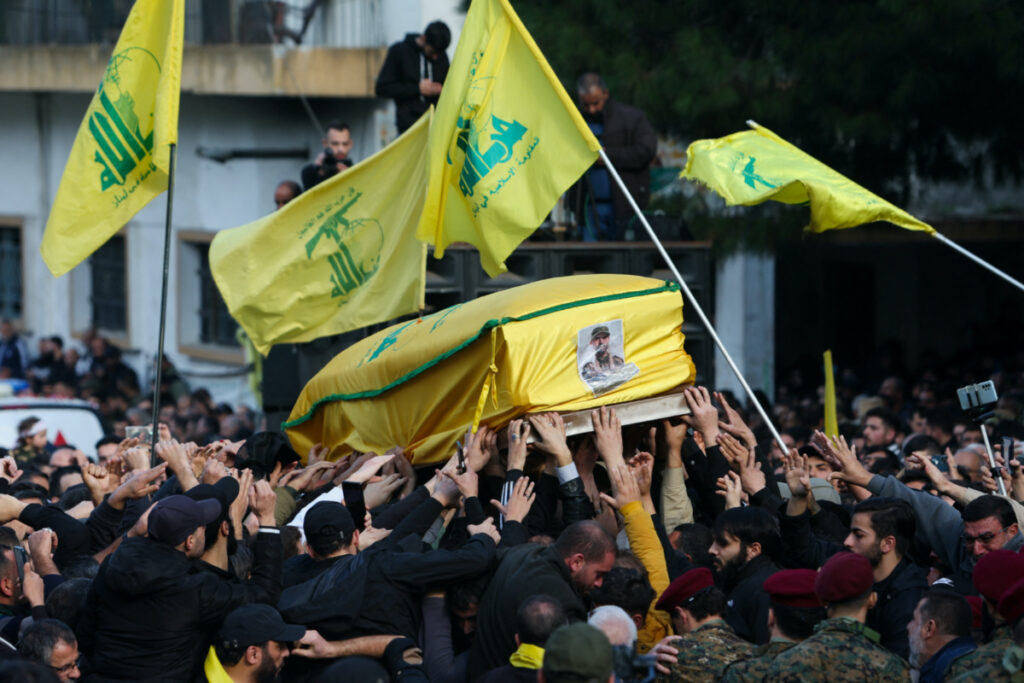 Mourners carry a coffin during the funeral of Wissam Tawil, a commander of Hezbollah’s elite Radwan forces who according to Lebanese security sources was killed during an Israeli strike on south Lebanon, in Khirbet Selm, Lebanon, on 9th January, 2024