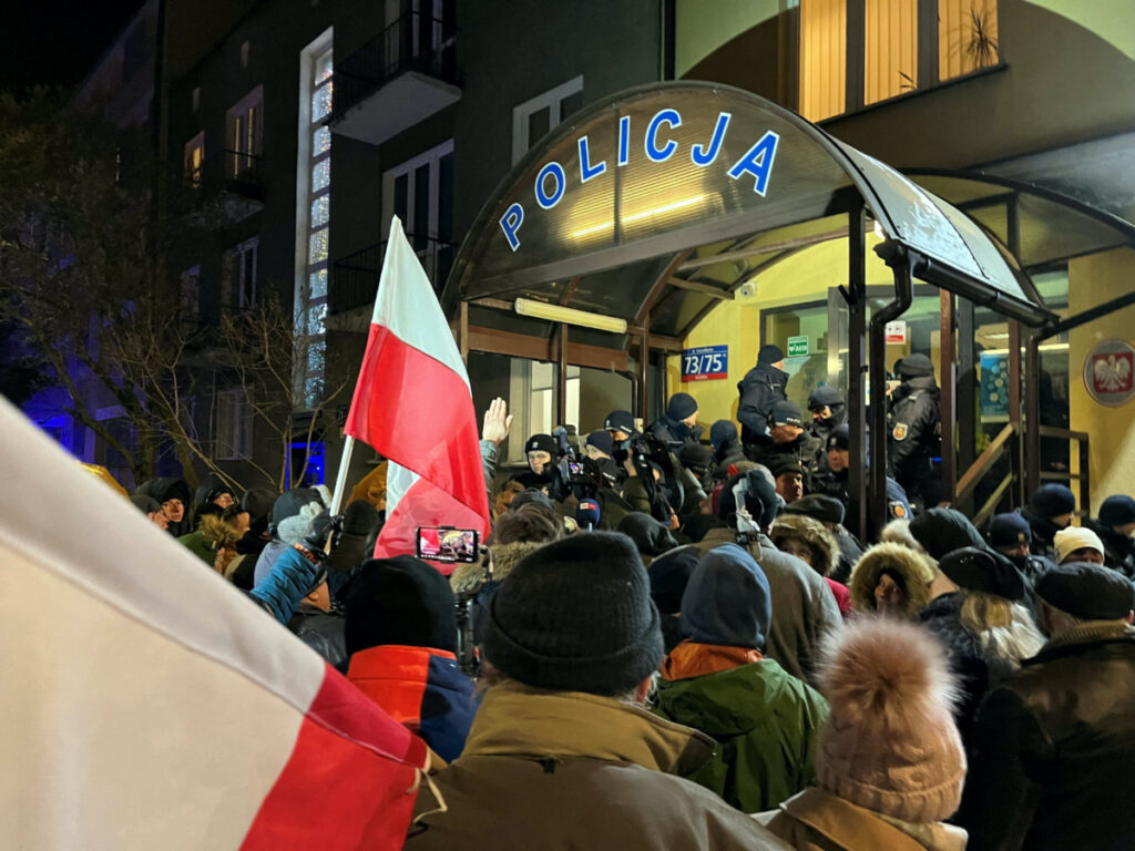Protesters gather in support of former Interior Minister Mariusz Kaminski and his deputy Maciej Wasik from Law and Justice party, in front of the police station were both politicians are detained in Warsaw, Poland, on 9th January, 2024.