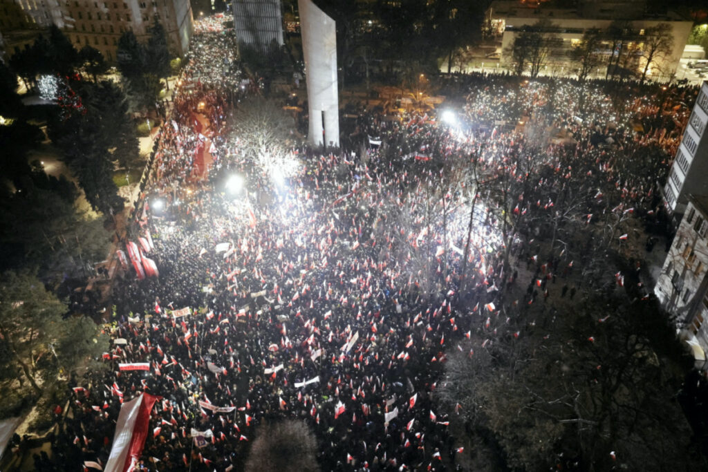 Supporters of the Law and Justice party gather in protest against state media overhaul and arrest of former interior minister and his deputy in Warsaw, on 11th January, 2024