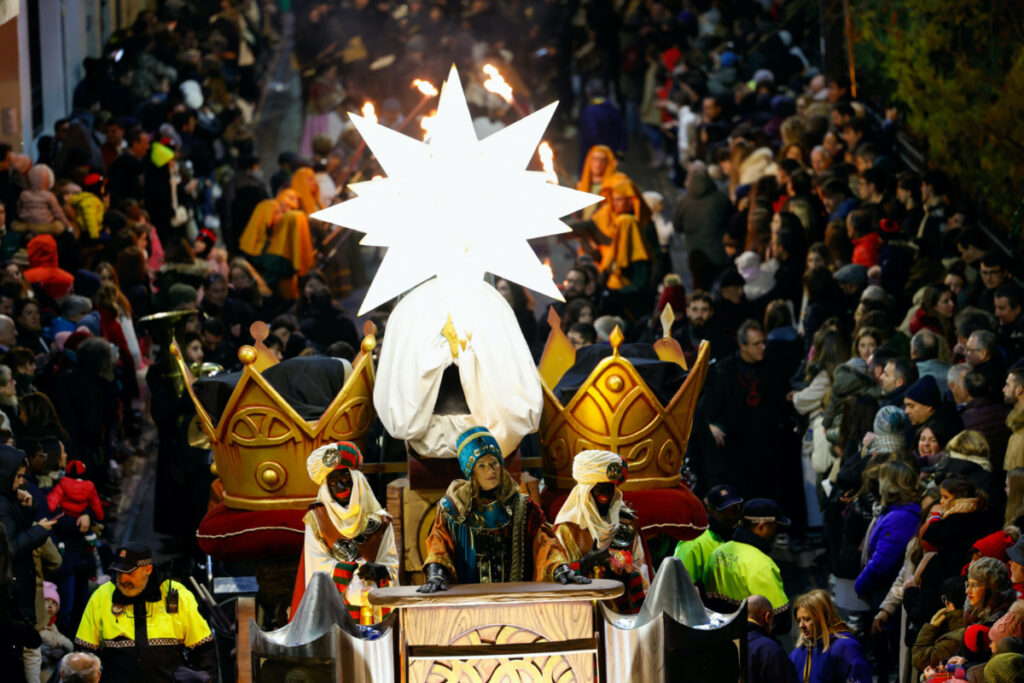 Participants dressed in costumes, and wearing blackface, take part in the annual Epiphany eve parade of the Three Kings, in Alcoy, Spain on 5th January, 2024.