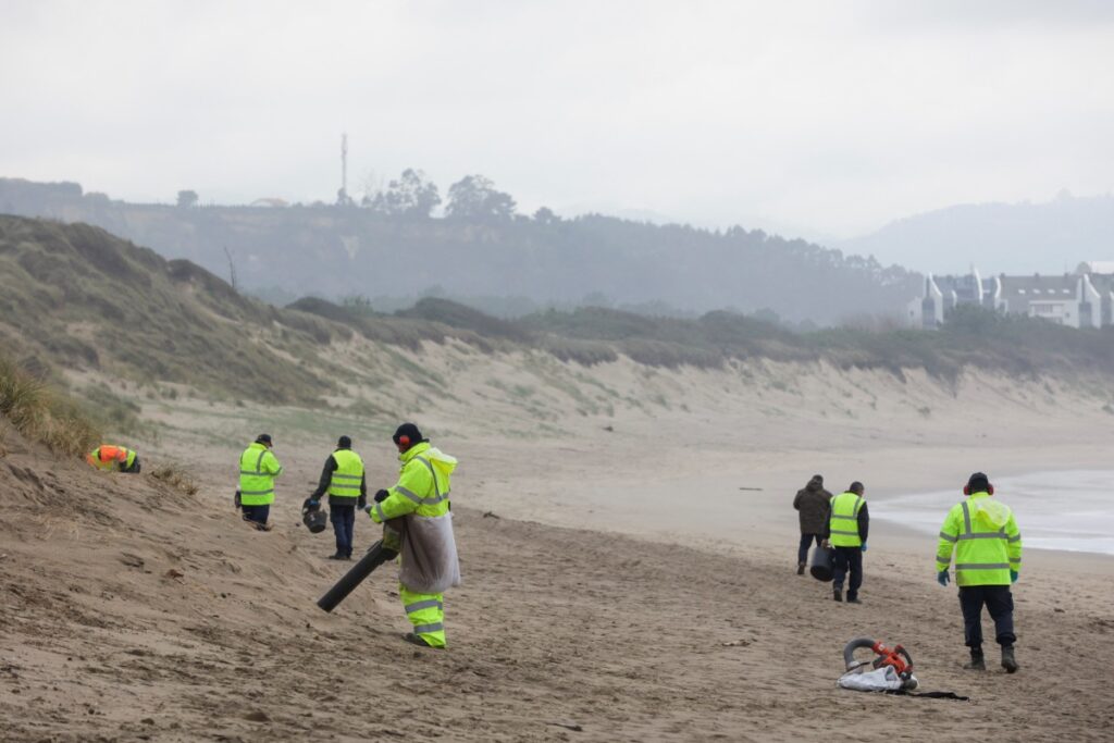 A teams sent by Spain’s Environment ministry clean-up plastic pellets that have spread from the Spanish northwestern Galicia region to the Asturias region, triggering environmental concerns and a political blame game in San Juan beach in Asturias, Spain, on 10th January, 2024.