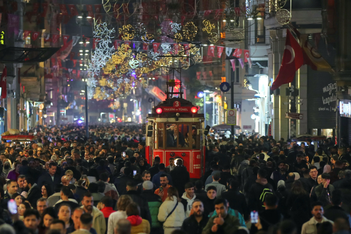 People stroll at the main shopping and pedestrian street of Istiklal on New Year's eve in central Istanbul, Turkey on 31st December, 2023. 