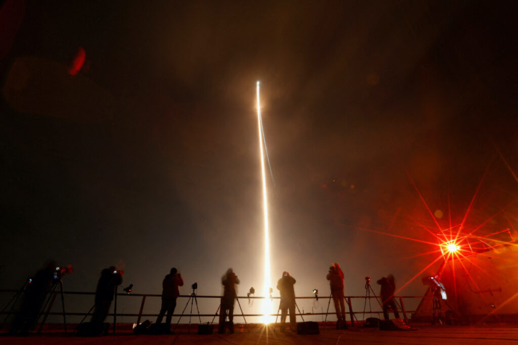 People take photographs during the launch of Boeing-Lockheed joint venture United Launch Alliance's next-generation Vulcan rocket on its debut flight from Cape Canaveral, Florida, US on 8th January, 2024.